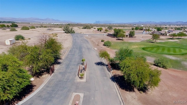 aerial view with a mountain view and golf course view