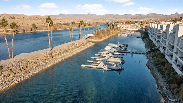 aerial view featuring a water and mountain view