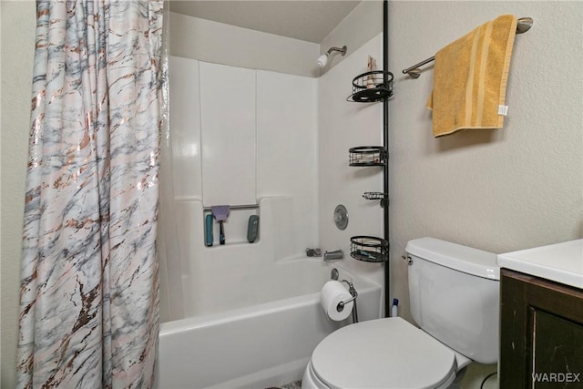 full bath featuring toilet, a textured wall, vanity, and shower / tub combo with curtain