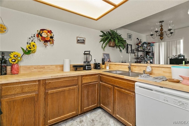 kitchen featuring dishwasher, wood counters, and brown cabinets