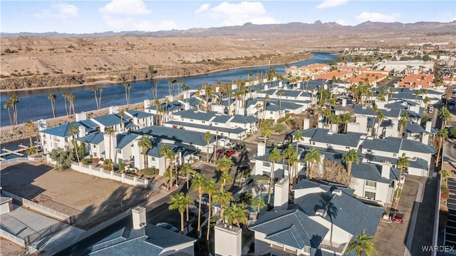 bird's eye view with a residential view and a water and mountain view