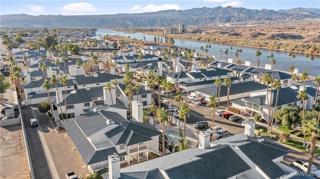 bird's eye view with a residential view and a water and mountain view