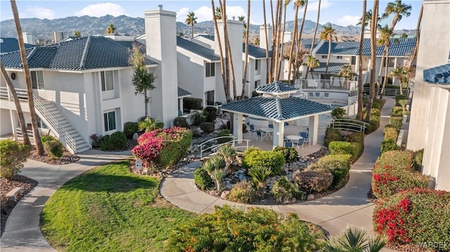 exterior space with a residential view and a mountain view