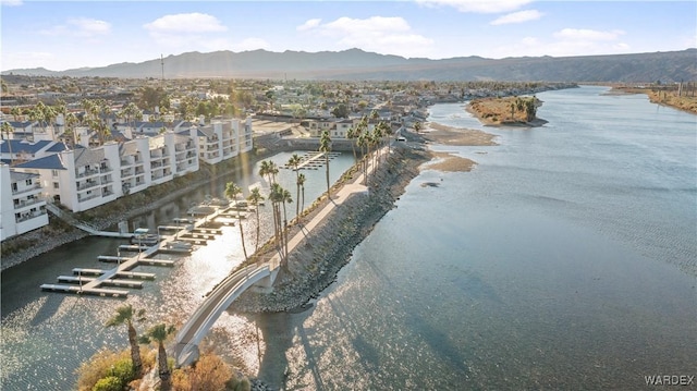 bird's eye view with a water and mountain view