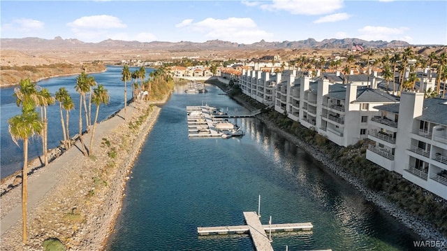 bird's eye view with a water and mountain view