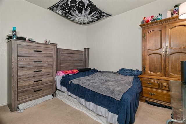 bedroom featuring light carpet