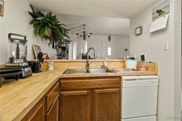 kitchen featuring a sink, butcher block countertops, brown cabinetry, and dishwasher