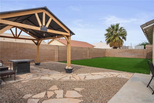 view of yard featuring a gazebo, a fenced backyard, and a patio area