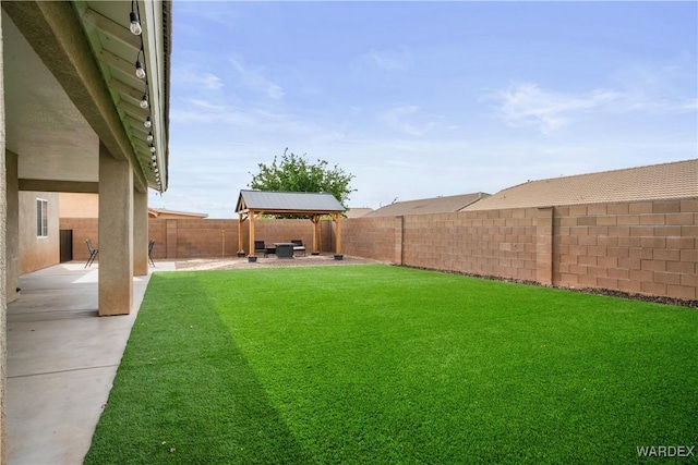 view of yard with a gazebo, a fenced backyard, and a patio