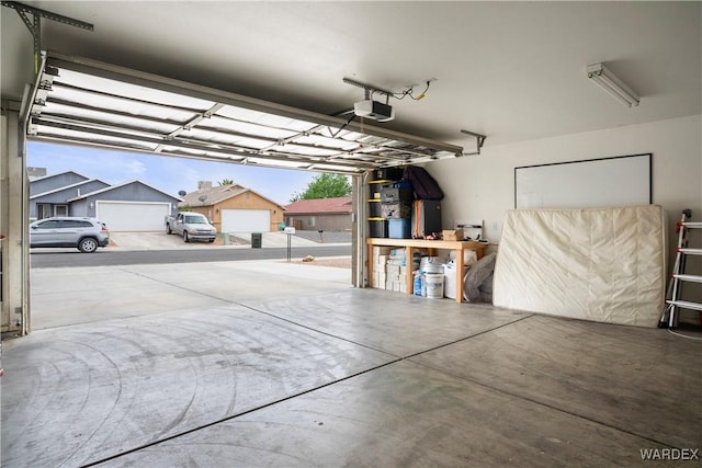 garage with a residential view and a garage door opener
