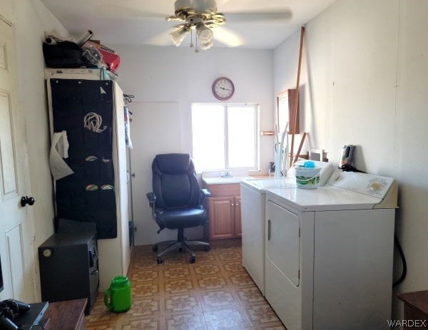 washroom featuring cabinet space, washer and clothes dryer, ceiling fan, light floors, and a sink