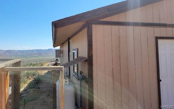 view of property exterior with a mountain view