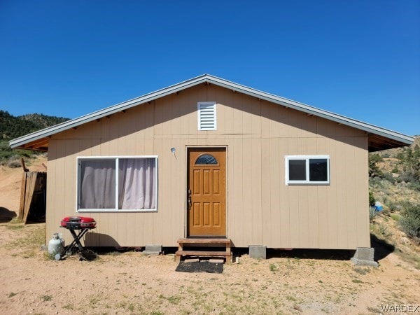 back of house with entry steps