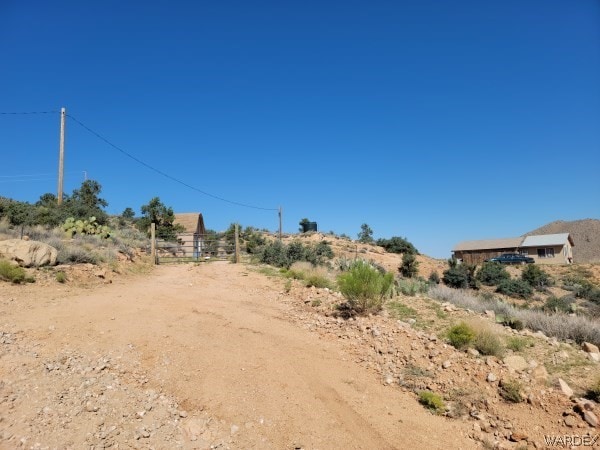 view of yard with a rural view