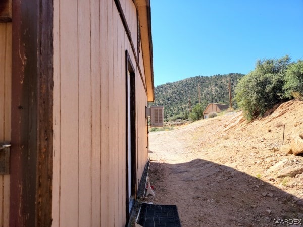 view of property exterior featuring a mountain view