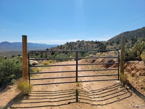 view of gate featuring a mountain view