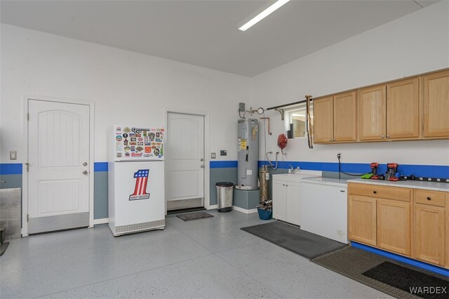 garage with water heater and fridge