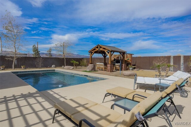 view of pool featuring a gazebo, a patio area, and a fenced backyard