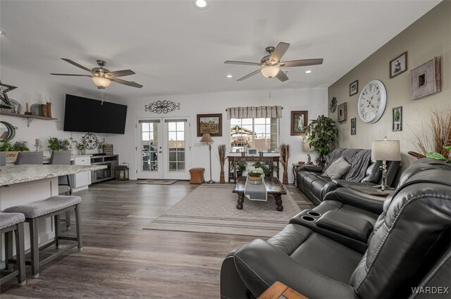 living area with ceiling fan, french doors, dark wood finished floors, and recessed lighting