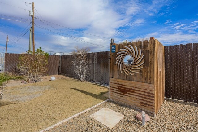 view of gate featuring fence