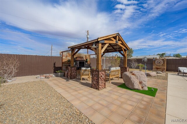 view of patio with a fenced backyard and a gazebo