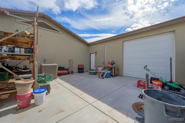 exterior space with concrete driveway and central AC unit