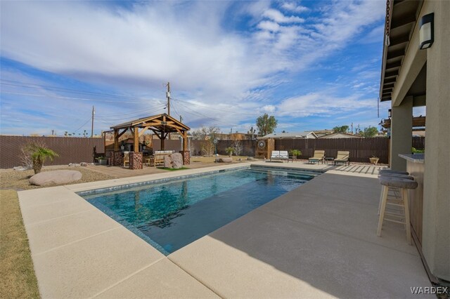 view of pool featuring a patio area, a fenced backyard, and a gazebo