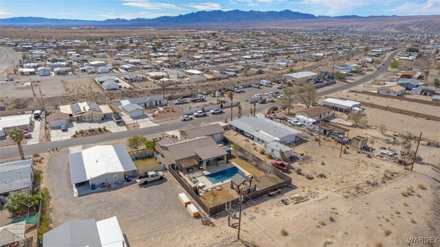 drone / aerial view featuring a residential view and a mountain view