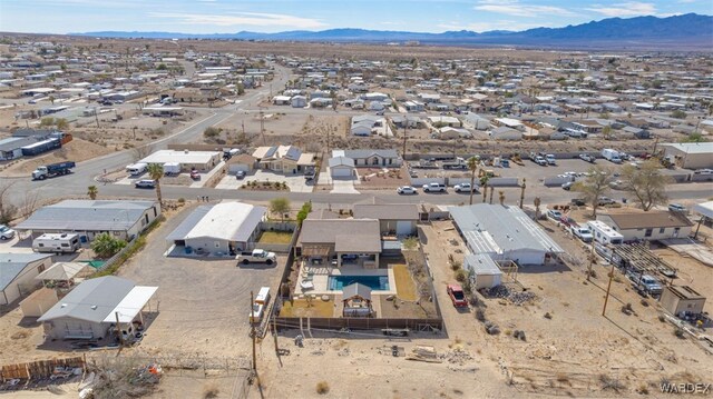 drone / aerial view with a residential view and a mountain view