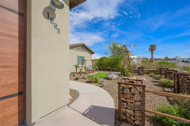 view of patio featuring fence