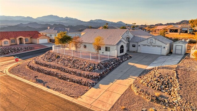 drone / aerial view featuring a mountain view and a residential view