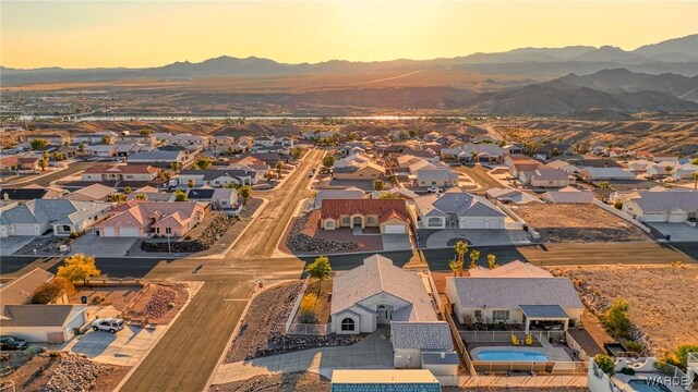 drone / aerial view featuring a residential view and a mountain view