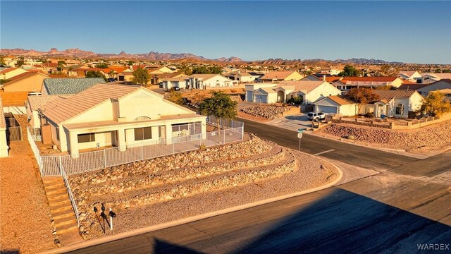 drone / aerial view with a residential view and a mountain view