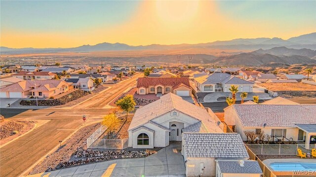 drone / aerial view with a residential view and a mountain view