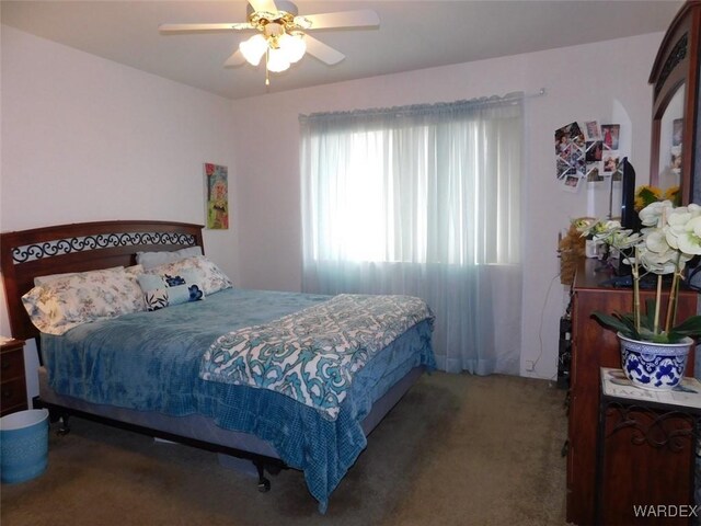 bedroom with carpet floors and a ceiling fan