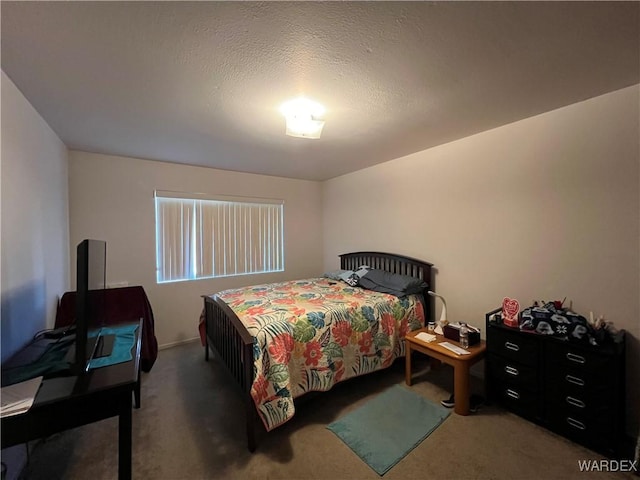 carpeted bedroom with a textured ceiling