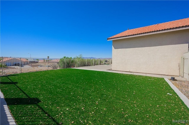 view of yard with a patio area and a fenced backyard