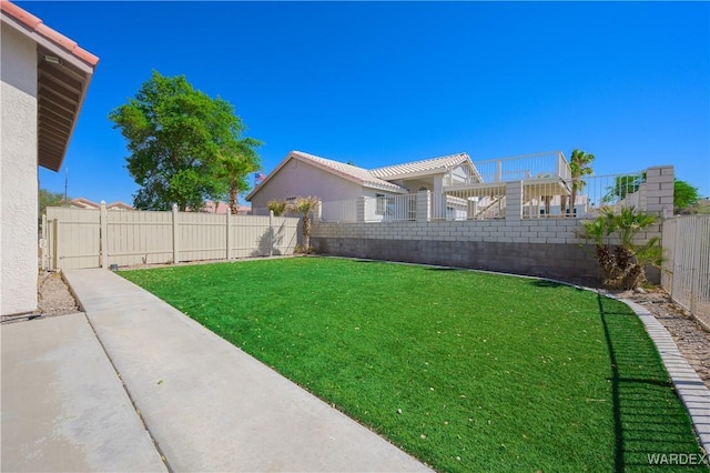 view of yard with a fenced backyard