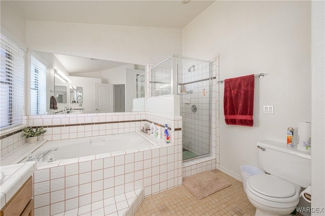 bathroom featuring a garden tub, toilet, vanity, a shower stall, and tile patterned floors