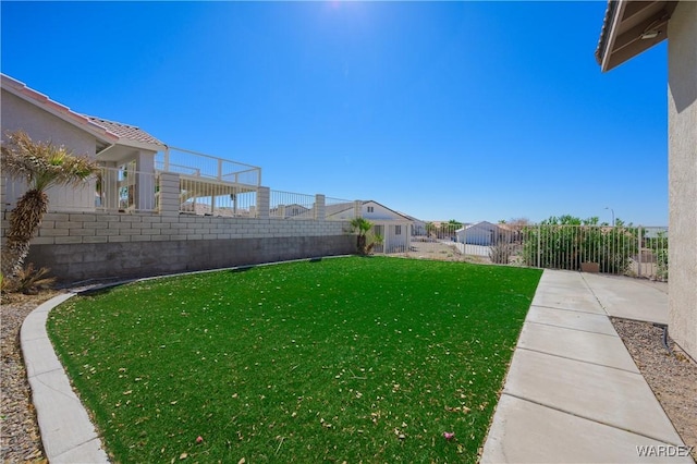 view of yard with a fenced backyard