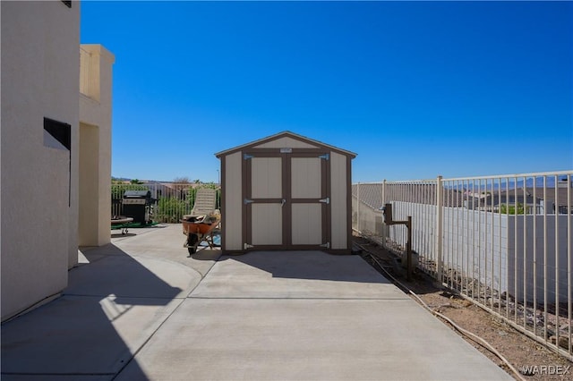 view of shed featuring a fenced backyard