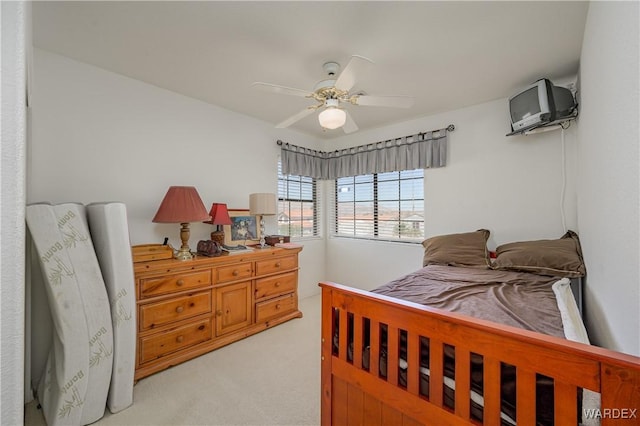 bedroom with light colored carpet and ceiling fan