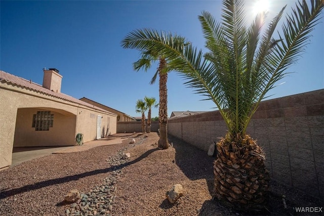 view of yard featuring a patio and a fenced backyard