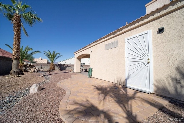 exterior space with a patio and fence