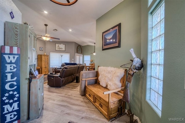 living room with light wood finished floors, visible vents, recessed lighting, and a ceiling fan