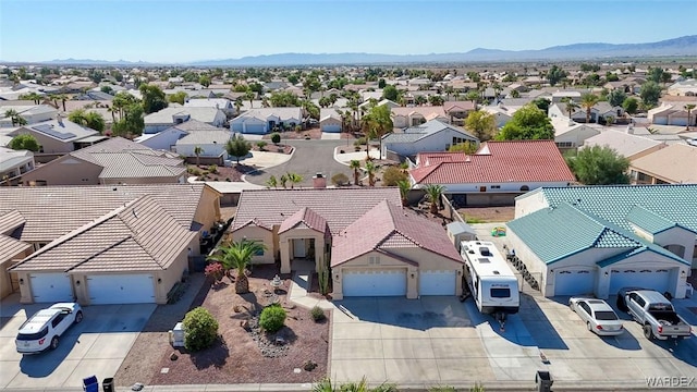 aerial view with a mountain view and a residential view