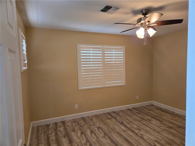 3836 Heather Ave, Kingman, AZ 86401 - unfurnished room with ceiling fan, wood finished floors, and baseboards