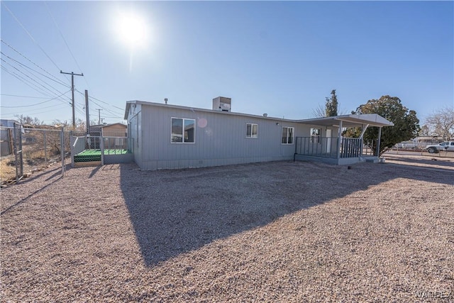 rear view of house with fence