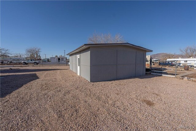 view of outdoor structure with fence