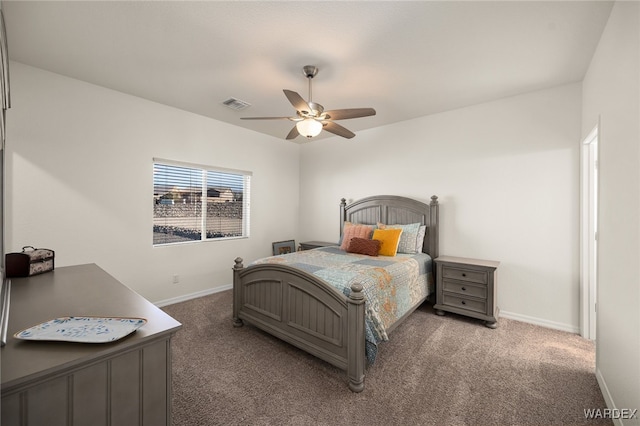 bedroom featuring ceiling fan, visible vents, baseboards, and dark colored carpet